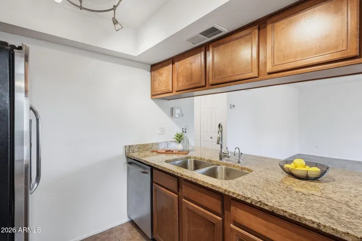 Functional kitchen with easy access to the main living areas, perfect for hosting or everyday cooking in this Scottsdale condo near Old Town.