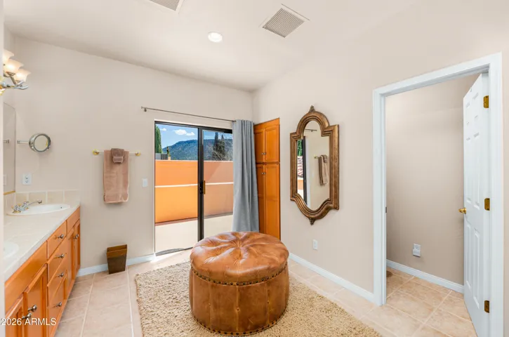 ...bathroom connecting directly to the private rooftop deck