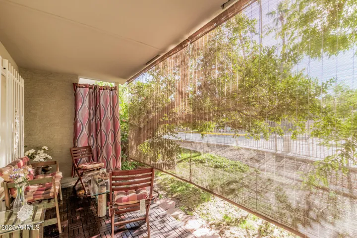 overlooks the green space and pool area.