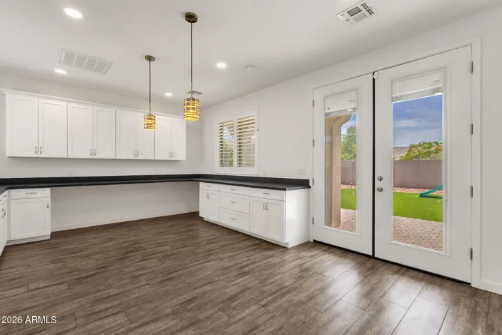 French doors lead to paver covered patio