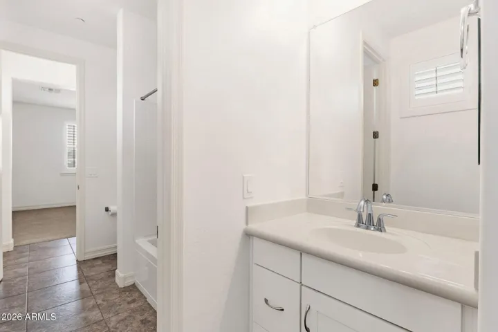 Sinks are separated from the shower/tub space so each can get ready while one is in the shower.