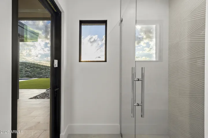 This secondary bathroom also has a separate exit to the back patio design for pool use