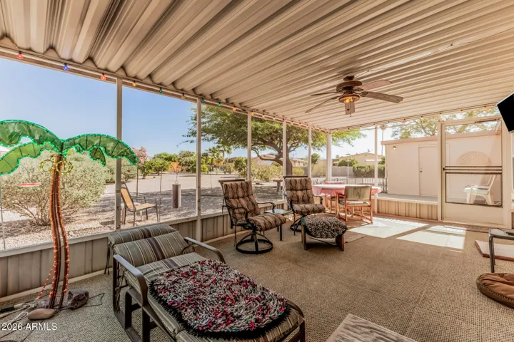 LARGE COVERED PATIO WITH NEWER SCREENS OVERLOOKING HUGE LOT
