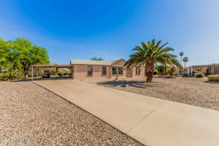 COVERED PARKING FOR 3 CARS WITH ROOM FOR SEVERAL MORE IN LONG DRIVEWAY