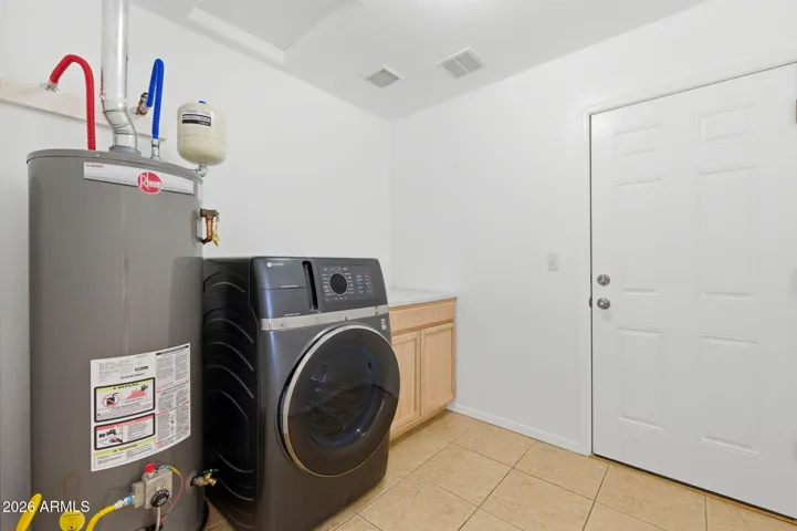 With combination washer/dryer and access to garage