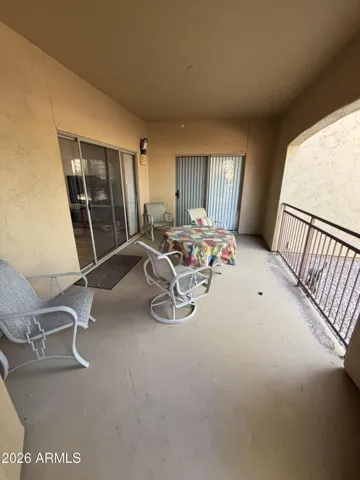 2 Sliding Glass Doors to access West covered patio from Living Room and Primary Bedroom
