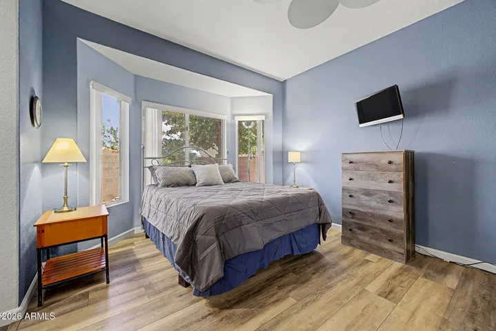 Serene primary bedroom with a charming bay window, creating a relaxing retreat.