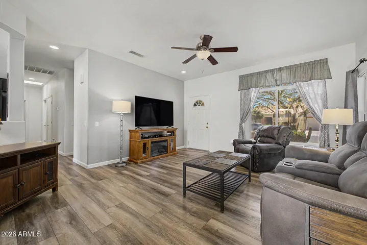 Open concept living space with new luxury vinyl plank flooring.