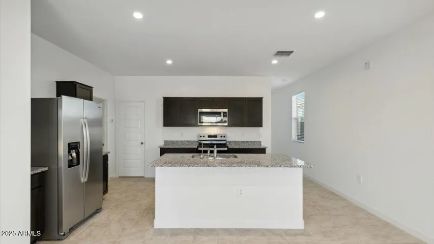Photos are of a spec and may vary in color, interior selections and design