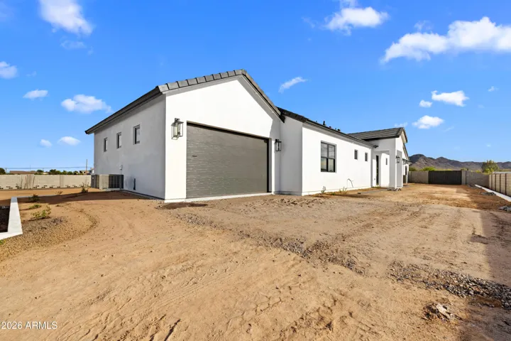 Oversized single car garage attached to the guest house, Paver driveway completed after photos.