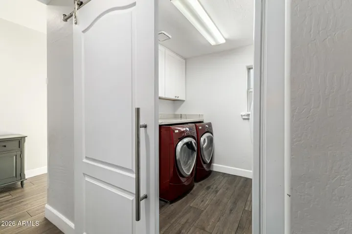 downstairs laundry with sliding door