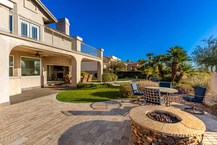 large covered patio spans width of the house