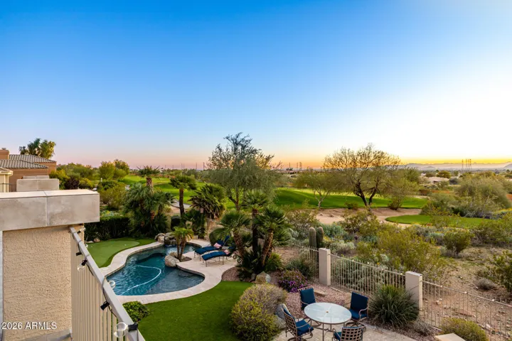 view of pool/golf course from balcony