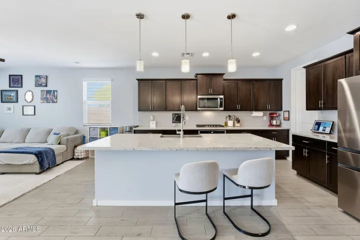 Open floor plan kitchen with great room and dining area