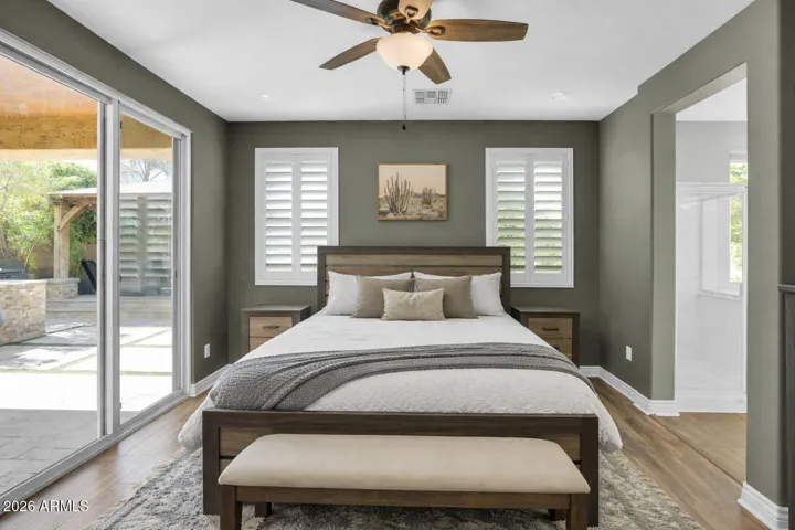 Primary suite with double-door entry, creating a sense of separation and a private retreat within the home.