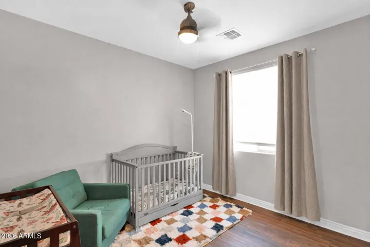Additional bedroom located near the primary suite, ideal for keeping the littles nearby.