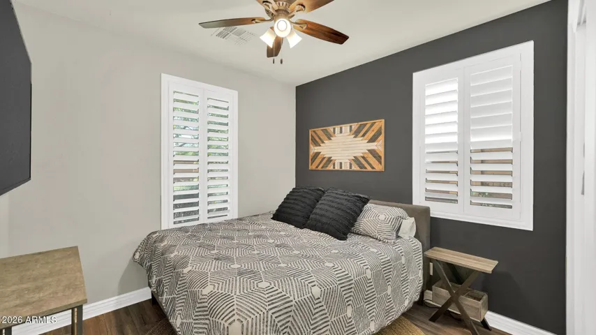 Private guest bedroom just off the entry, thoughtfully split from the other bedrooms with an adjacent bathroom, ideal for guests or multigenerational living.
