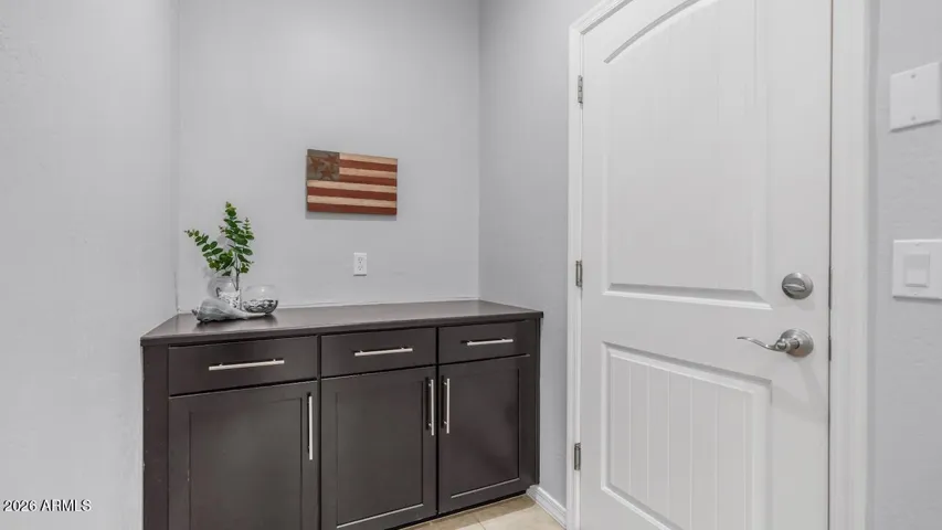 As you enter from the garage, you'd got a place for your keys and mail.
