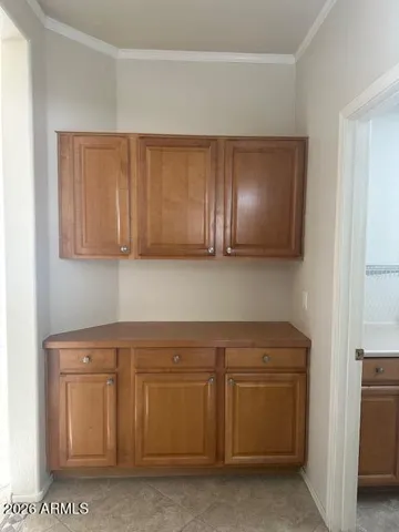 Just outside the laundry room and steps from the hall bath this space has been uniquely utilized as a large linen cabinet area.