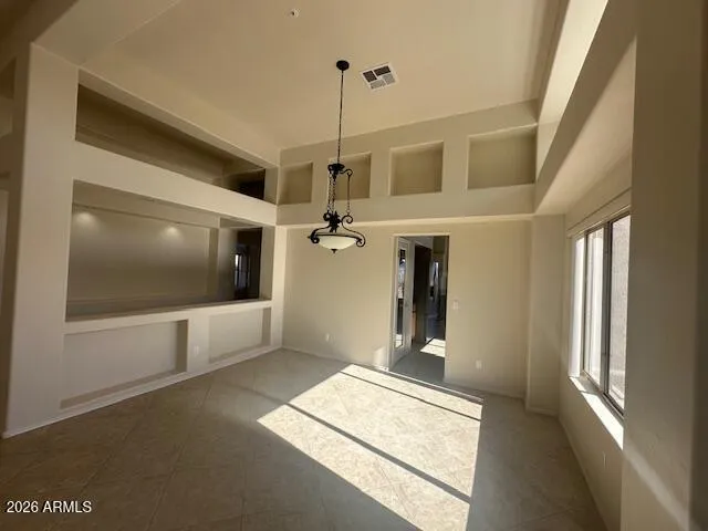The living room opens up to this uniquely designed dining area with great views.