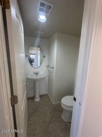 A half bath is conveniently located just off the family room. Great for movie nights.