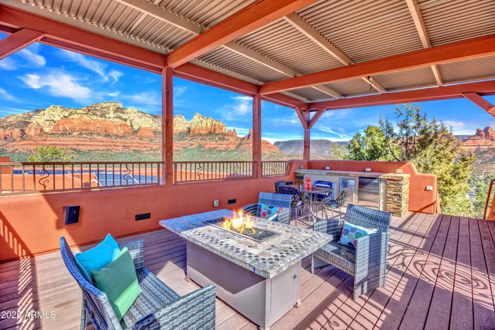 Upper Covered sky deck 329 Sq ft features electronic shades for even more privacy. Buffet bar built in for Above the Clouds Happy Hours.