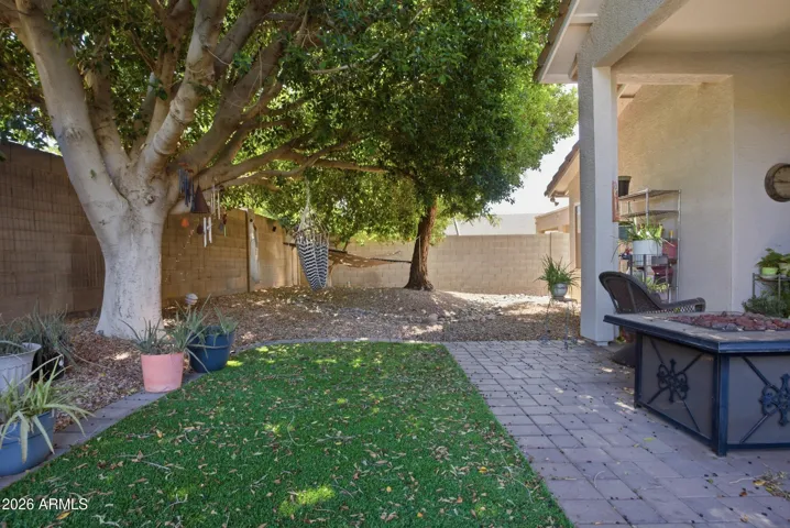 Mature landscaping keeps this yard very private and cozy