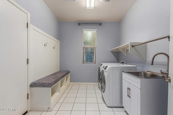 LAUNDRY ROOM AND ENTRY TO GARAGE NEAR FOYER
