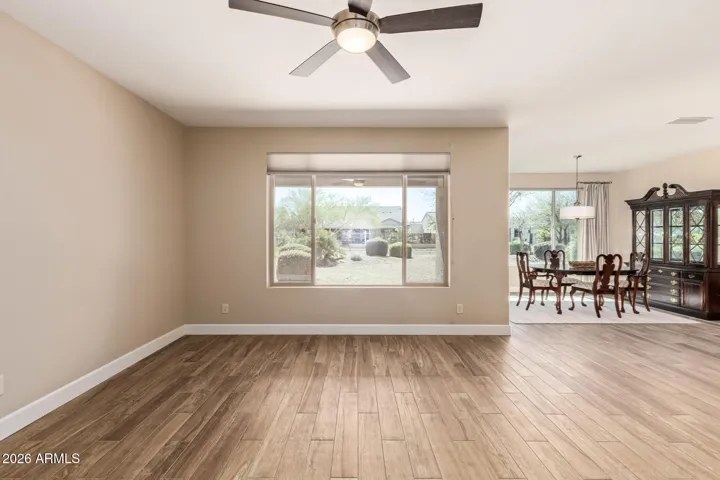 Great room with views to the back yard and dining space