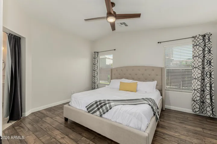 Primary bedroom w/ vaulted ceilings