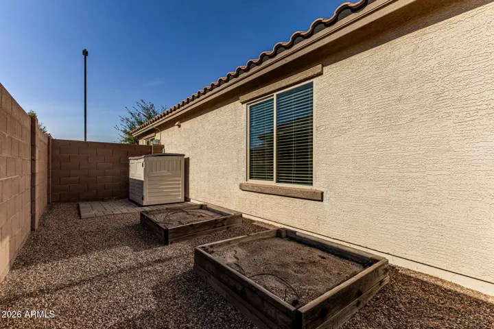 Side yard w/ garden beds w/ drip system