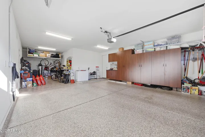 3 car tandem garage with epoxy floor and California Closet storage