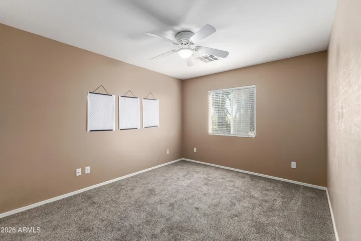 2nd bedroom with ceiling fan
