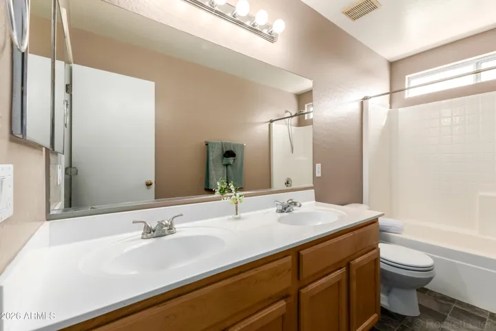 Primary full bath with double vanity.