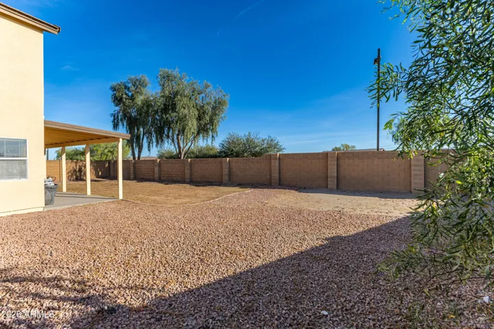 Wide side yard! Perfect for a pool or sport court.