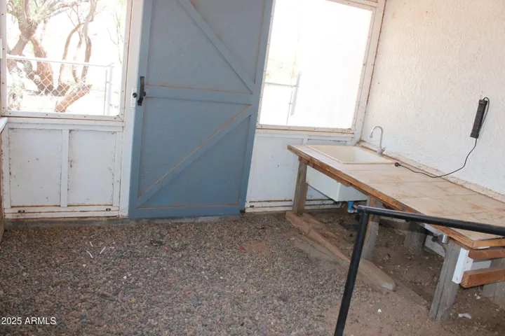 Plant station at the end of the covered front entry/complete with electric and water/sink