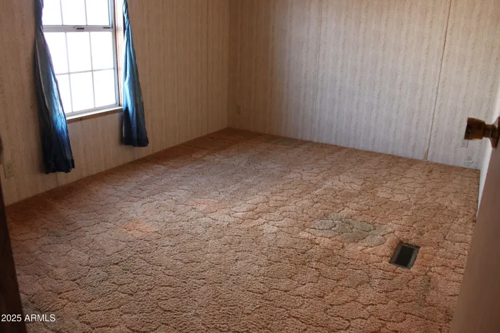 Guest bedroom one enjoys lots of natural light from south facing window