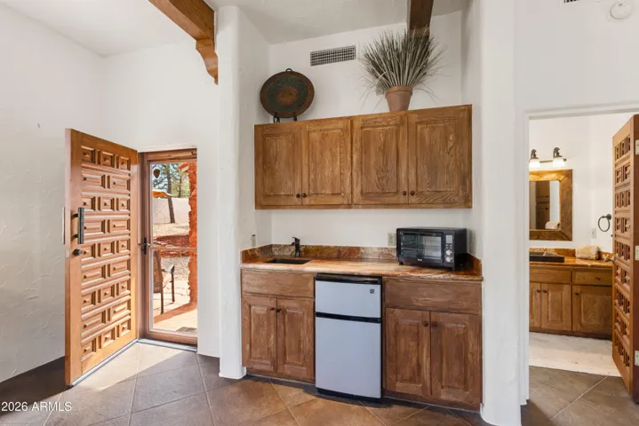 Featuring a kitchenette, en suite bath, and walk in closet