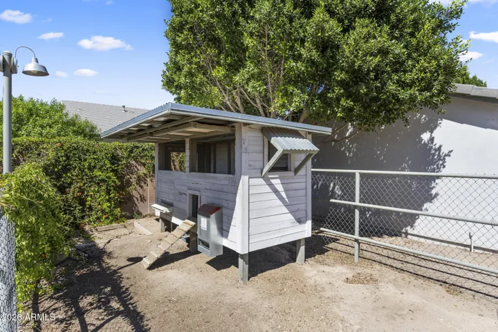 fenced chicken coop