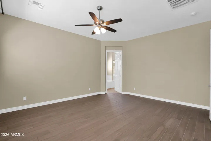 Primary Bedroom facing Primary Bathroom