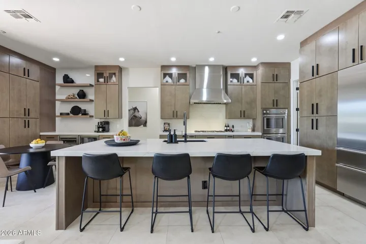 Show stopping Chef's kitchen, gas cooktop, stainless appliances, Beverage station, etc.