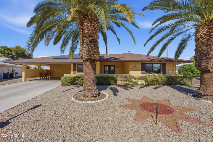 Meticulous front landscape with palms will welcome your guests!