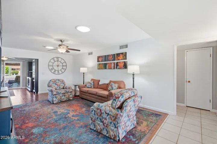 Family room with new laminate floors, open to kitchen and bonus space