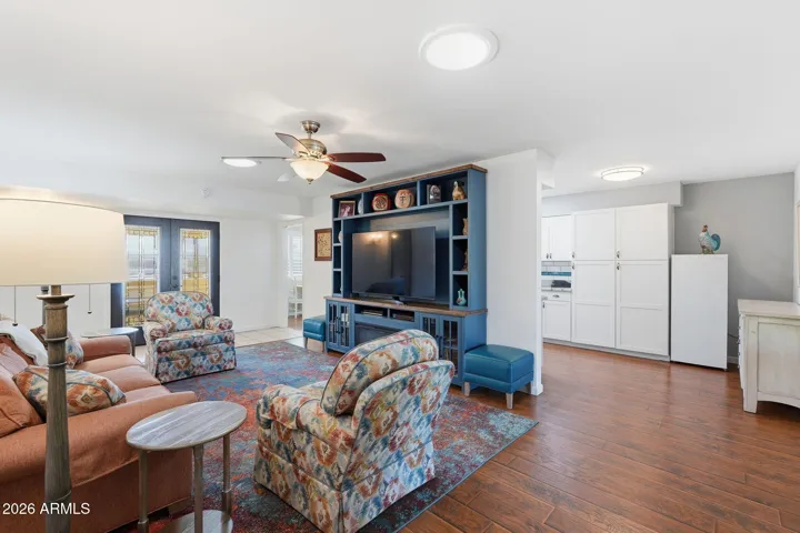 Family room with new laminate floors, open to kitchen and bonus space.