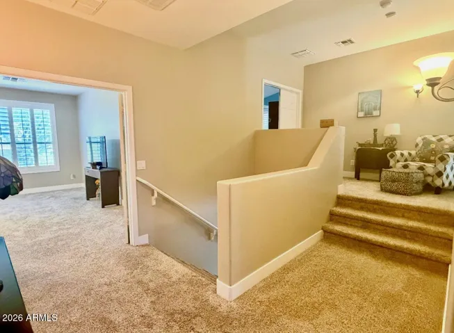 Upstairs Hallway, stairs lead to Master Suite, to Left is the Great Room and behind are additional Bedrooms