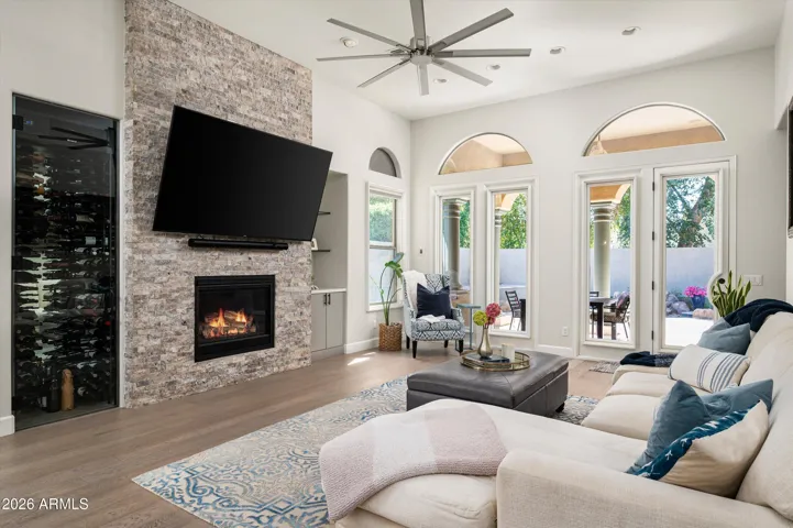 Built-in refrigerated wine storage and display, perfect for collectors and entertaining, adding a luxury touch to this Phoenix home’s custom bar area.