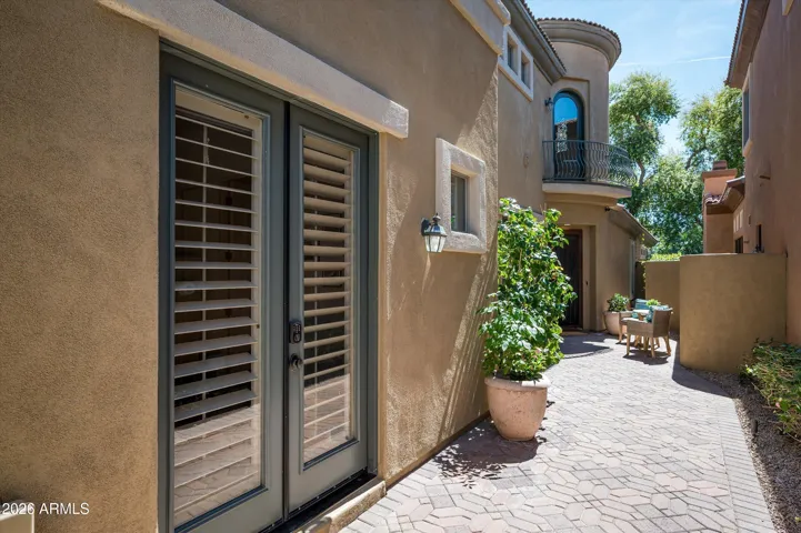 Separate casita entrance off the courtyard, offering privacy and flexibility for guests, office use, or multi-generational living in this Phoenix property.