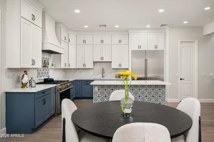Spacious kitchen with abundant cabinetry, walk-in pantry, and premium finishes, offering both style and functionality in this updated Phoenix home designed for everyday living.