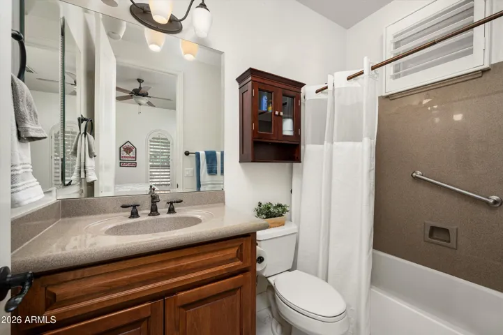 Well-appointed casita bathroom with functional layout and clean finishes, providing convenience and privacy for guests in this Phoenix residence.