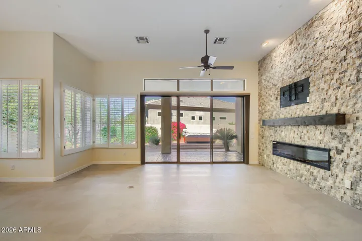 Floor to ceiling Stacked stone Modern Fireplace